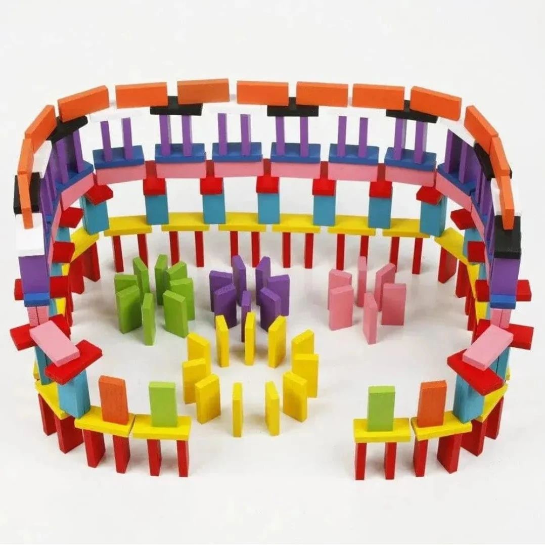 Wooden dominoes standing in a curved chain-reaction layout