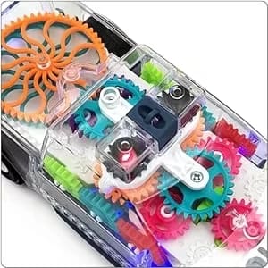 Close-up of the coloured moving gears inside the transparent car